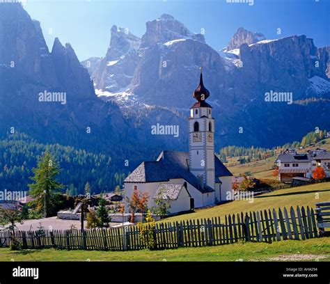 Church And Alpine Village Of Colfusco Italy In The Dolomite Mountains