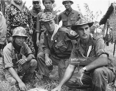 Us Army Advisors And Vietnamese Troop Leaders Check The Progress Of