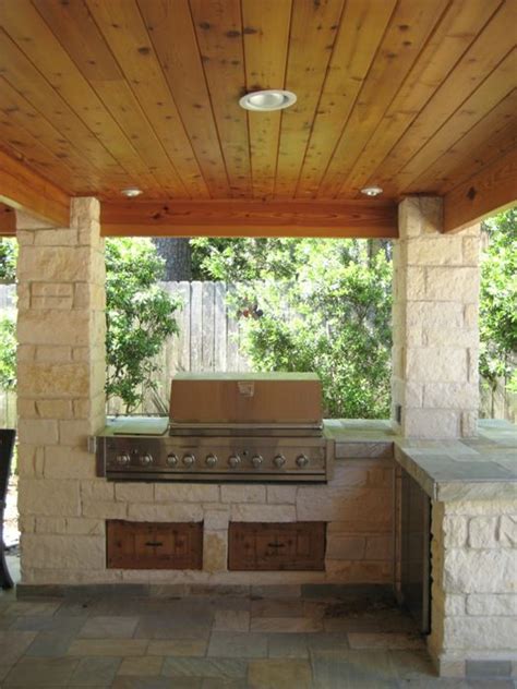 Get our best ideas for outdoor kitchens, including charming outdoor kitchen decor, backyard decorating ideas, and pictures of outdoor kitchens. Limestone columns and outdoor kitchen in Houston, Texas with tongue and groove ceiling and slate ...