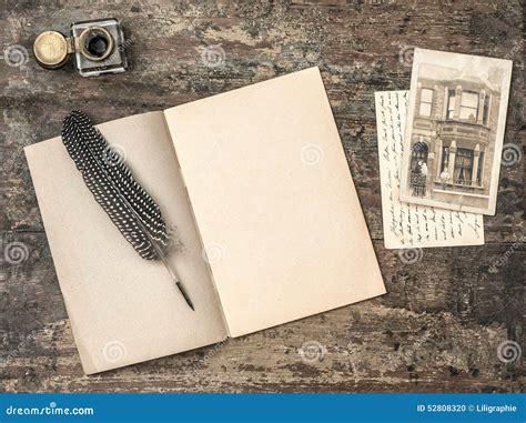Open Book Vintage Writing Tools Feather Pen And Inkwell Stock Photo