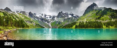 Mountain Landscape With Turquoise Lake And Cloudy Sky Stock Photo Alamy