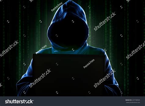 Faceless Hooded Anonymous Computer Hacker With Programming Digital Code