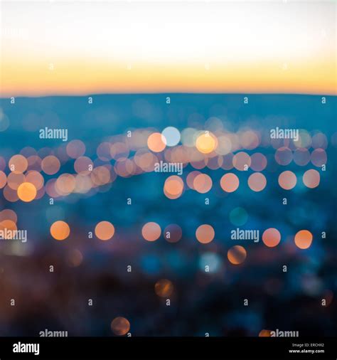 City Blurring Lights Abstract Circular Bokeh On Blue Background With