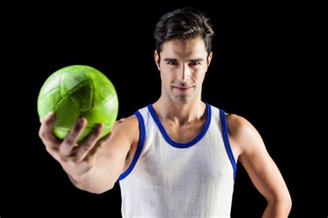 Premium Photo Portrait Of Happy Male Athlete Holding A Ball