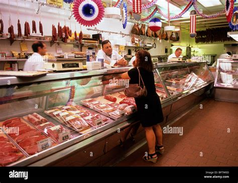 New York Woman At The Meat Counter In A Butcher Shop On Arthur Avenue