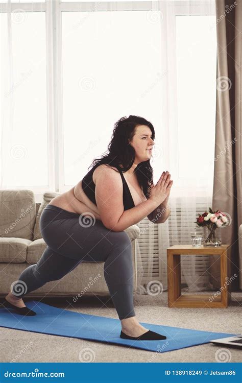 overweight woman stretching during home training stock image image of laptop overweight