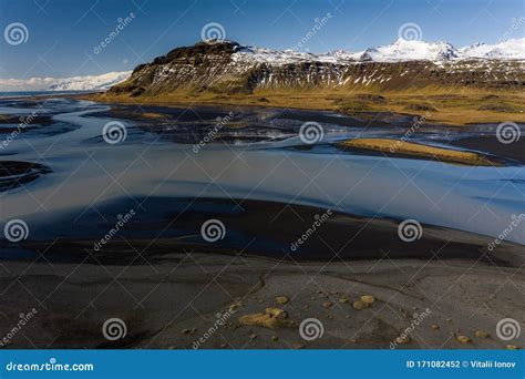 Aerial View Of Patterns Of Icelandic Rivers Flowing Into The Ocean