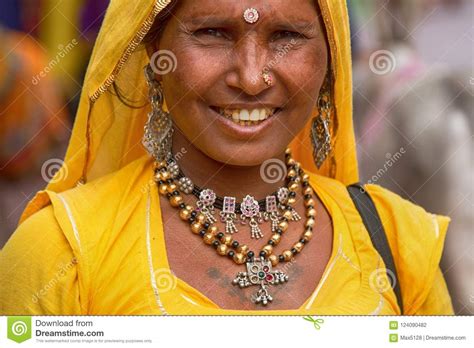 Portrait Of Mature Indian Woman In Yellow Blouse And Yellow Veil