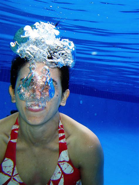Women Blowing Bubbles Underwater