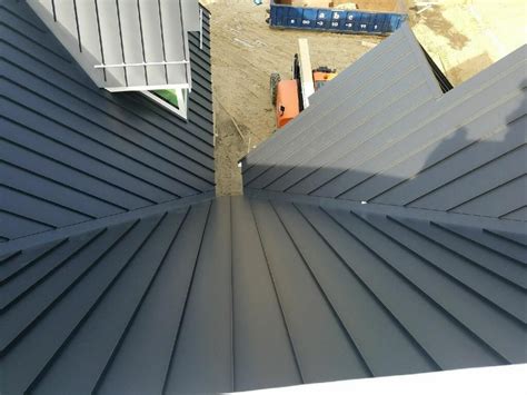 Matte Black Color Standing Seam Metal Roof From Atop Roof In Carver Ma