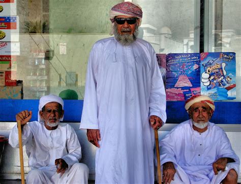 Three Old Arabian Men Wearing Omani Turbans In Khasab Oman Encircle
