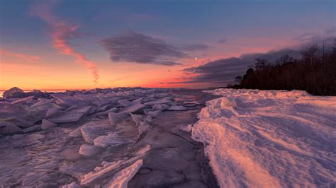 Frozen Sea Winter Cold Snow Coast Pieces From Broken Ice Red Sky Sunset