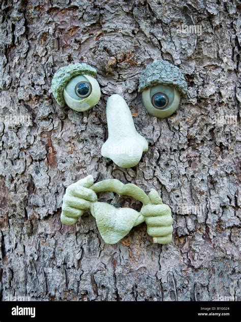 Artistic Ceramic Face Parts On Pine Tree Bark Stock Photo Alamy