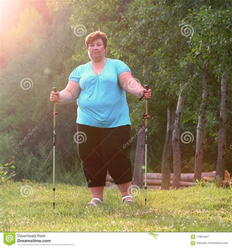 Overweight Woman Walking On Forest Trail Stock Image