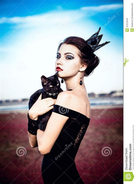 lady holding a cat real life body pose gothic hat poses cat pose