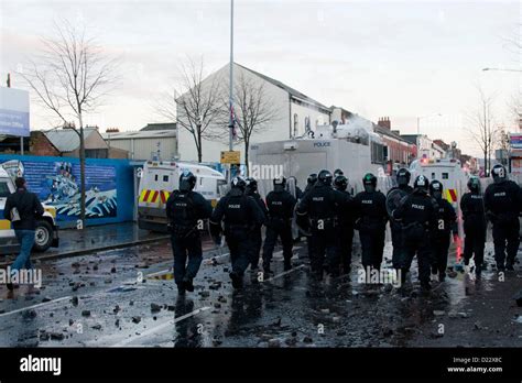 belfast uk 12 01 13 riot police charging loyalist youths as rioting breaks in the belfast