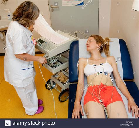 Woman Undergoing An Electrocardiography Ekg Examination
