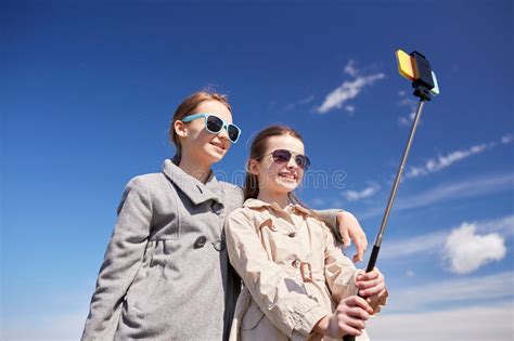 Happy Girls With Smartphone Selfie Stick Stock Photo Image Of Female