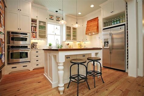 Thrifty decor chick's gray and white diy kitchen renovation featuring an extended island, additional lighting, extended cabinets and a two tone look. source: Old New Vintage kitchen with ceiling height white ...
