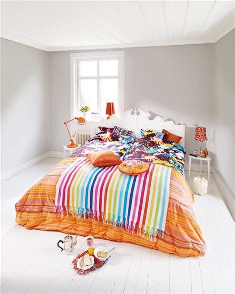 To achieve colorful effect in case the wall paint is of one color opt for colorful tapestry and furniture. Colorful Bedroom Designs | InteriorHolic.com