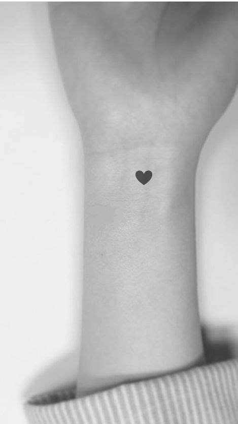 Wrist Tattoo Black Heart In 2020 Black Heart Tattoos Simple Wrist