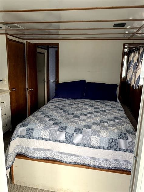 This houseboat also has 2 bathrooms with showers, a full kitchen, television with dvd, a flybridge with canopy, central air condtioning, a full size refrigerator, a large deck cooler. 1986 Kentuckian 14x56 houseboat SOLD! - Dale Hollow Boat Sales