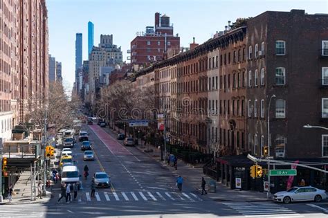 Street Lined With Old Colorful Brick Buildings In Chelsea Of New York