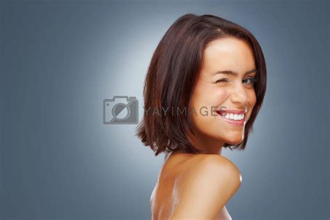 Pretty Naked Woman Giving You A Wink Against Colored Background