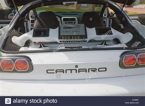 Enthusiasts at American car show modified cars with large stereo car
