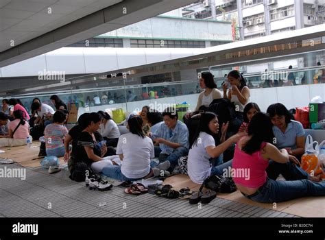 Filipino Maids Enjoying There Sunday Afternoon Mass Meeting In One Of Hong Kongs Malls Hong