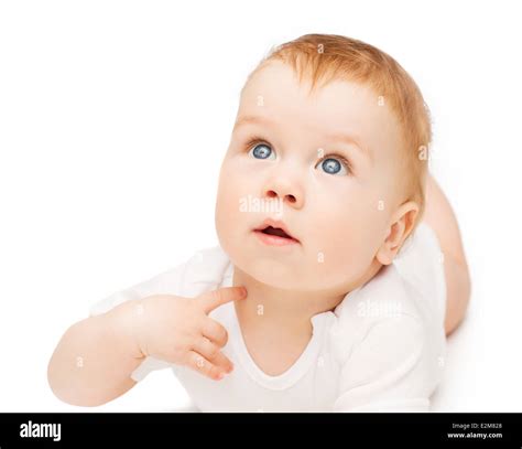 Curious Baby Lying On Floor And Looking Up Stock Photo Alamy