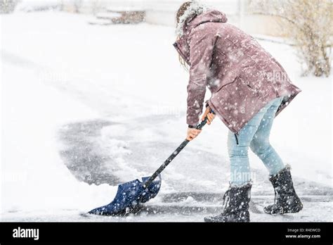Person Shoveling Snow Hi Res Stock Photography And Images Alamy