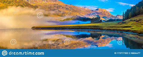 Mountain Lake At Sunrise In Autumn Landscape With Lake Gold Sunlight