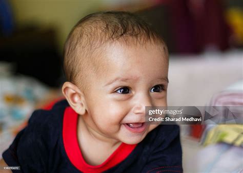Smiling Baby High Res Stock Photo Getty Images