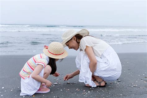 Japanese Girl Sitting At The Beach Stock Photos Pictures And Royalty