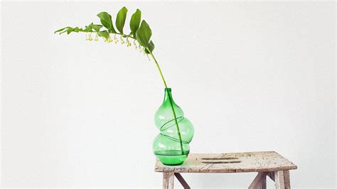 These Gorgeous Vases Are Made By Reblowing Used Wine Bottles