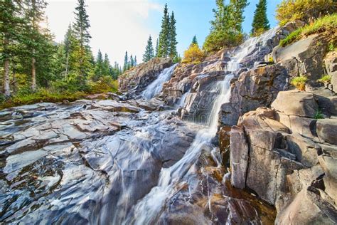 Close View Of Pair Of Waterfalls Over Tiers Of Gray Rock Stock Photo
