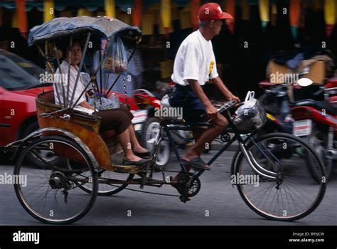 Thailand North Chiang Mai Cyclo Three Wheeled Trishaw Bicycle Rickshaw In Motion With Female