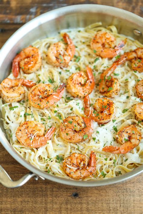 While the pasta is cooking, combine the cream, wine, garlic, and black pepper in a large skillet and bring to a simmer over high heat. Creamy Parmesan Garlic Shrimp Pasta