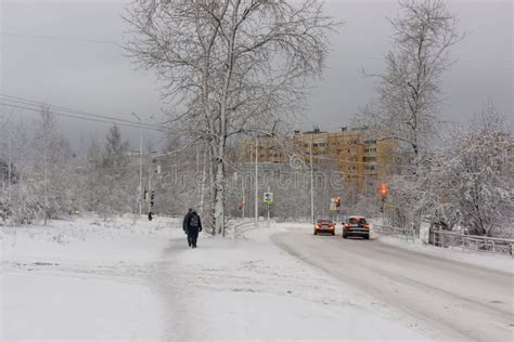 Winter Road With Deep Holes Water Ice And Snow In Russian City Stock