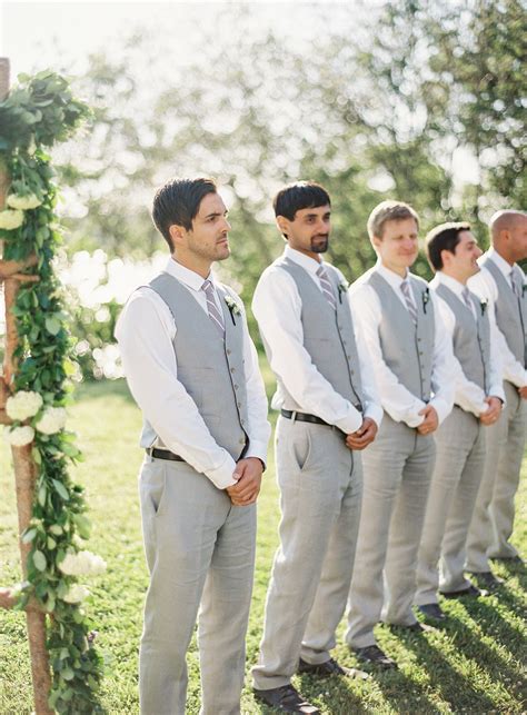 I vote groom and groomsmen in navy/tan, chambray/linen suits. Casual Groomsmen Style