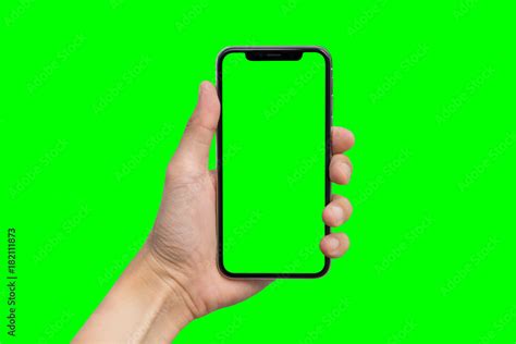 Mans Hand Shows Mobile Smartphone With Green Screen In Vertical