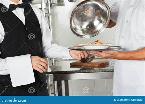 Chef Giving Pasta Dish To Waiter Stock Photo Image Of Caucasian