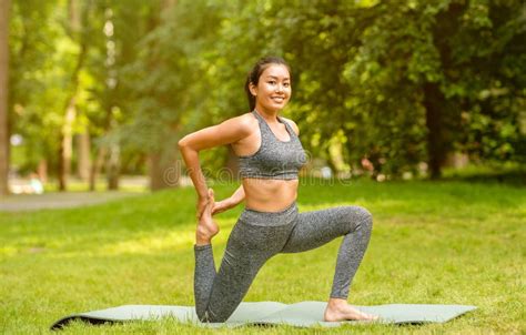 Flexible Asian Female Is Stretching On Mat At Home Stock Image Image