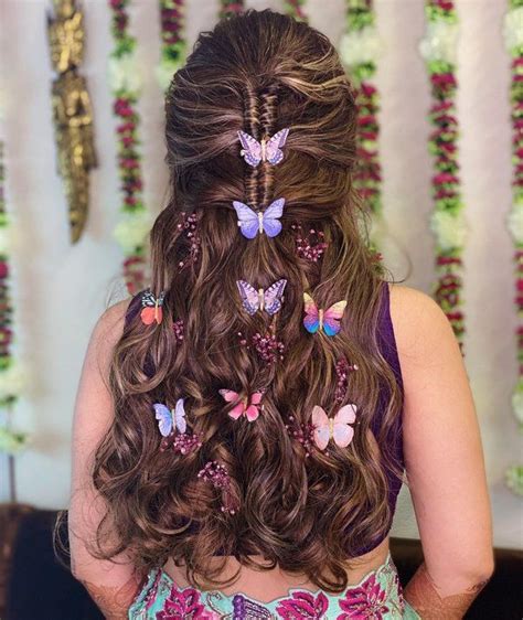 trendalert bridal hairstyles with butterfly accessories for mehndi haldi ceremony butterfly