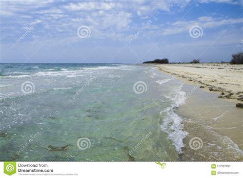 The Deserted Fairy Tale Beach With Golden Sand Beautiful Sky And
