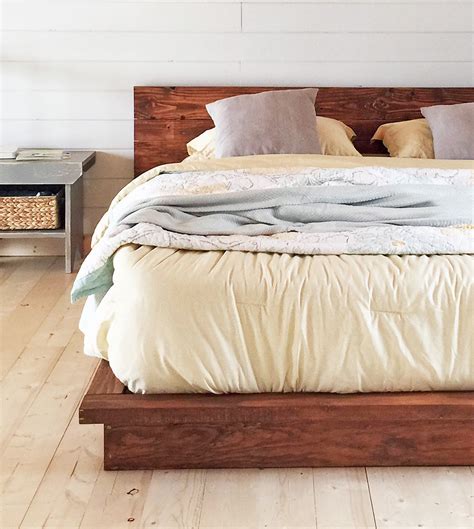 It's crucial that you find a wall with good studs that can support the bed. 18 Gorgeous DIY Bed Frames • The Budget Decorator