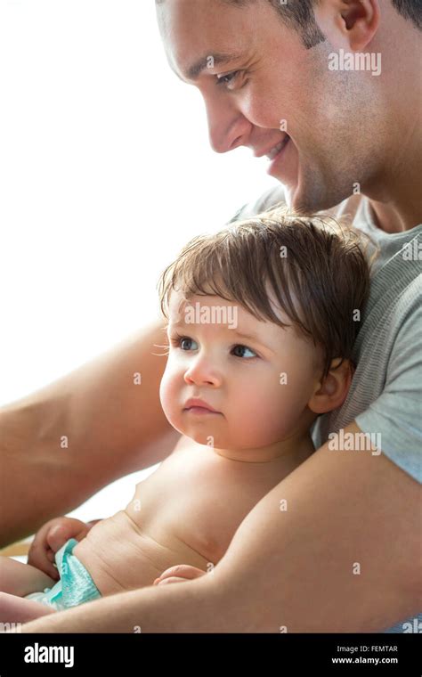 Father Cuddling His Baby Son Stock Photo Alamy