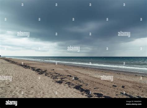 Beach With Dark Clouds And Incoming Rain Storm Vacation With Bad