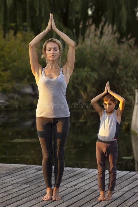 Mother And Son Exercising Yoga Pose Stock Image Image Of Nature